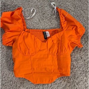Cute orange top! Size XS! Perfect for taking cute pictures or a night out!
